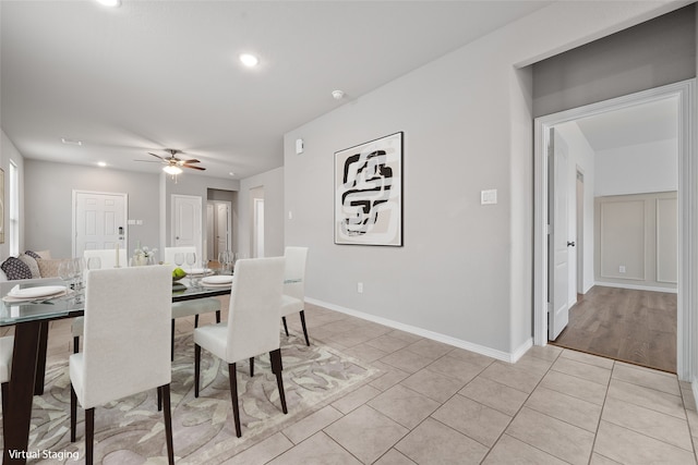 dining room with ceiling fan and light tile patterned floors