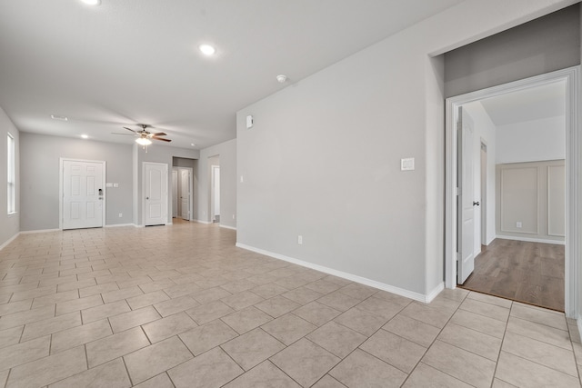 unfurnished living room featuring ceiling fan