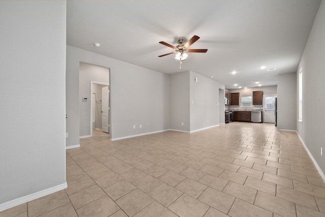 unfurnished living room with light tile patterned floors and ceiling fan