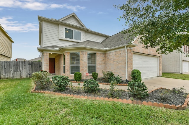 view of front facade with a front yard and a garage