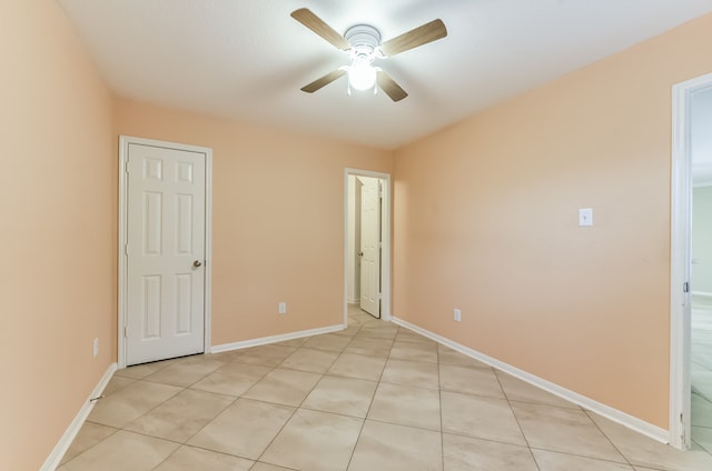 unfurnished bedroom featuring light tile patterned floors and ceiling fan