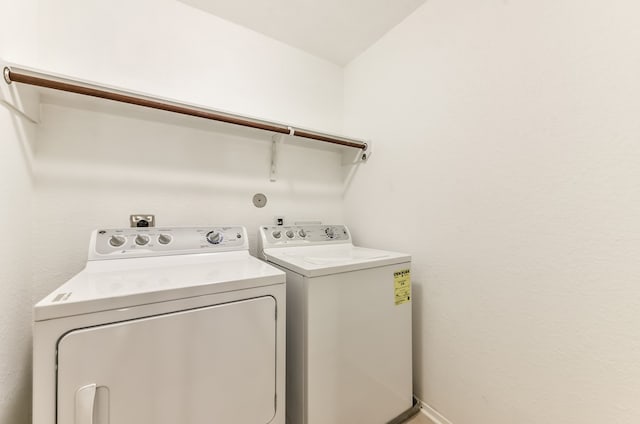 washroom featuring washer and dryer