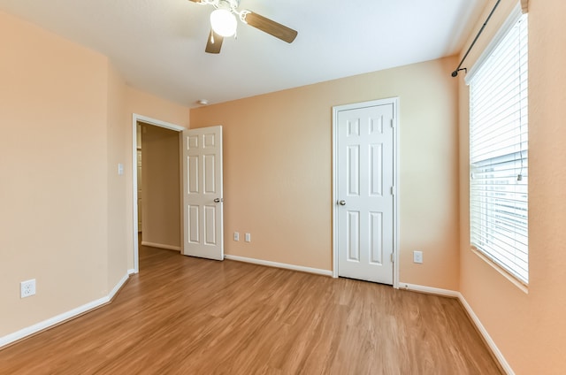 unfurnished bedroom featuring light hardwood / wood-style floors and ceiling fan