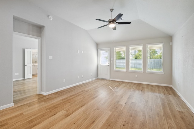 unfurnished room featuring light hardwood / wood-style floors, ceiling fan, and vaulted ceiling