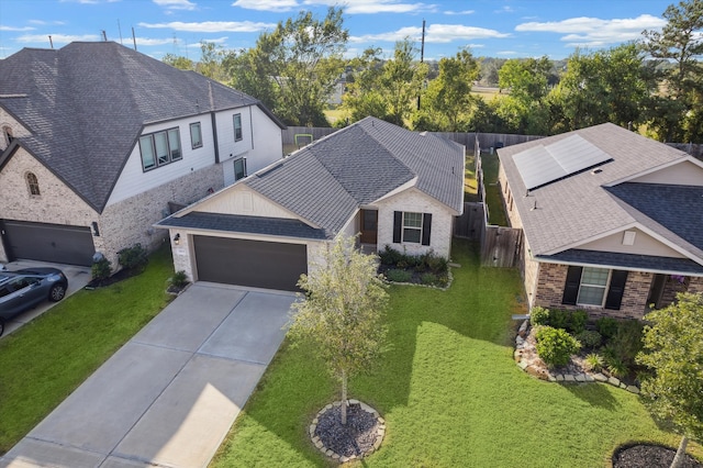 view of front of home featuring a front yard and a garage