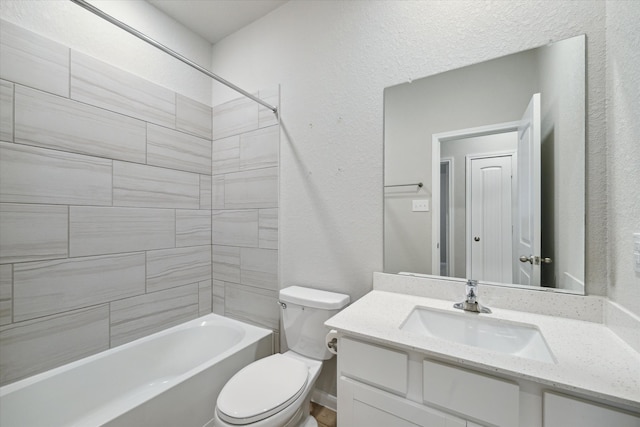 full bathroom with toilet, tiled shower / bath combo, and vanity