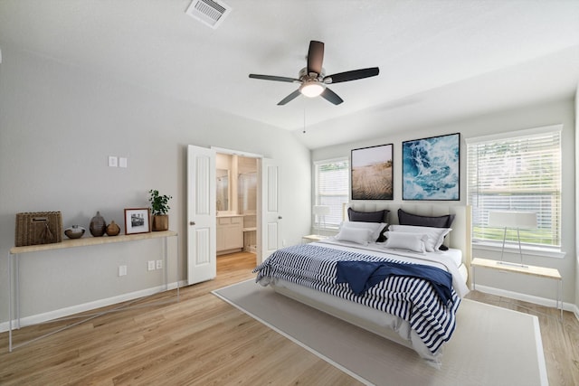 bedroom featuring connected bathroom, ceiling fan, and light hardwood / wood-style flooring