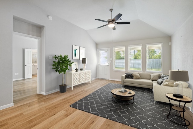 living room with lofted ceiling, hardwood / wood-style floors, and ceiling fan