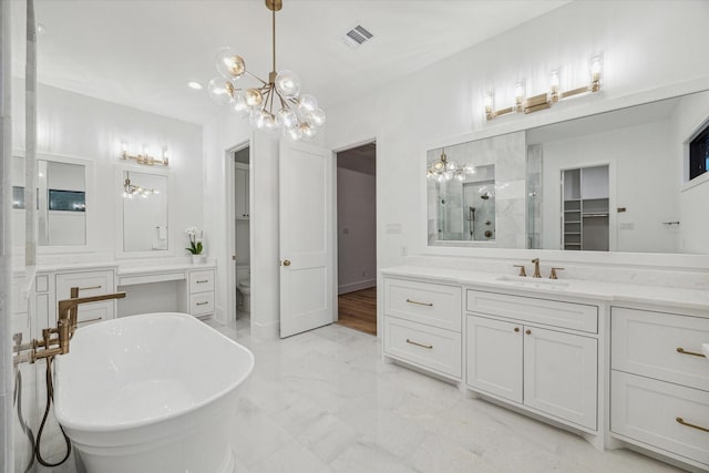 full bathroom featuring a notable chandelier, vanity, toilet, and plus walk in shower