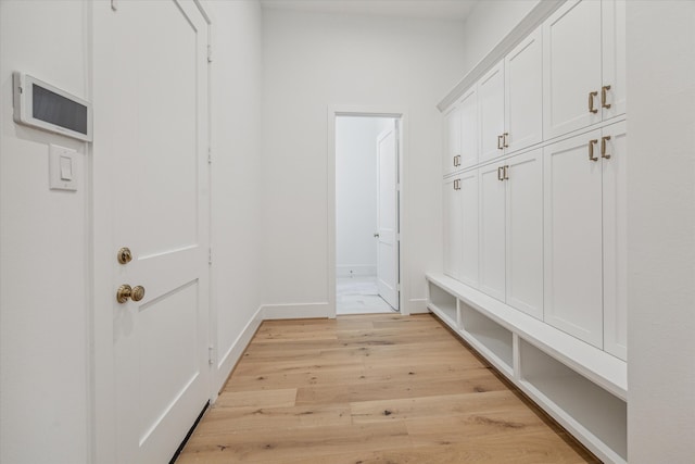 mudroom with light hardwood / wood-style floors