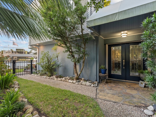 view of exterior entry featuring french doors