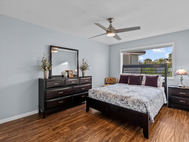 bedroom with dark wood-type flooring and ceiling fan