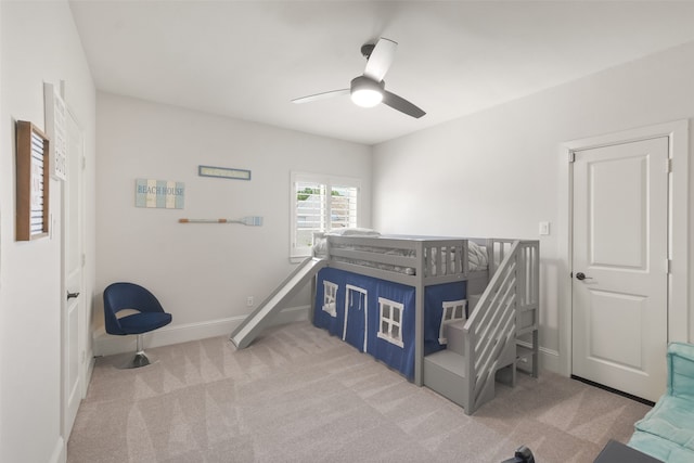 bedroom featuring light carpet and ceiling fan