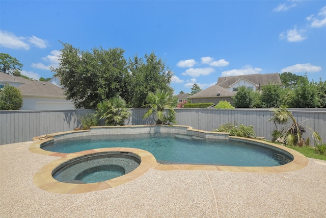 view of pool featuring an in ground hot tub