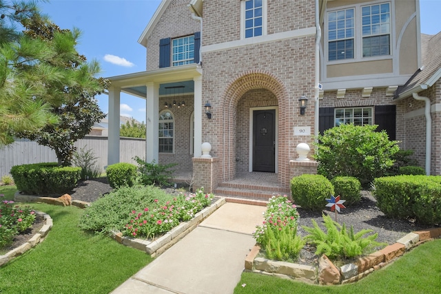 entrance to property with a yard