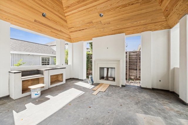 view of patio featuring a gazebo and exterior fireplace