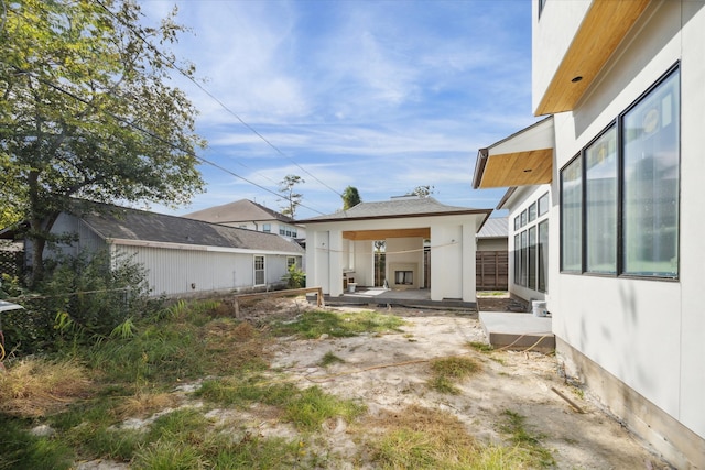 rear view of property featuring a patio