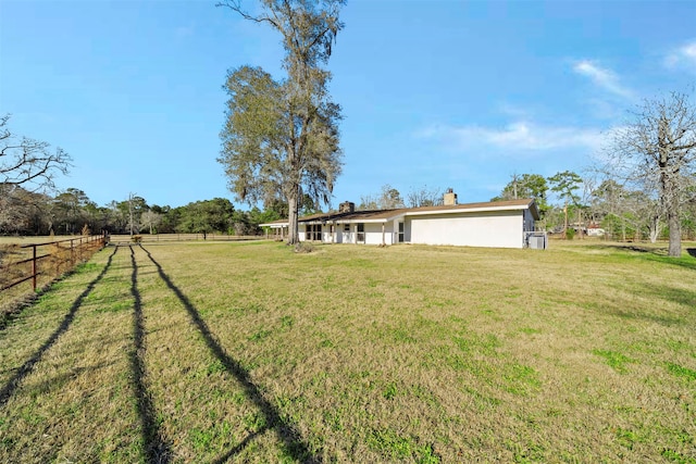 view of yard with a rural view