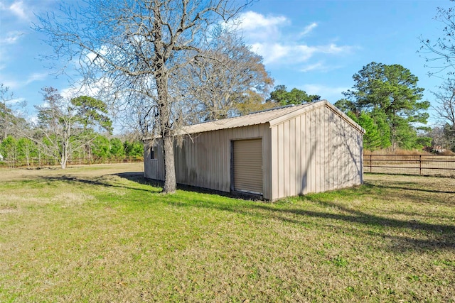 view of outbuilding with a lawn