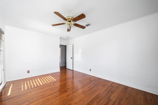 unfurnished room with ceiling fan, hardwood / wood-style flooring, and ornamental molding