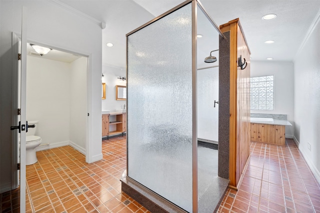 bathroom with tile patterned floors, toilet, crown molding, vanity, and an enclosed shower