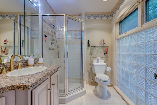 bathroom with vanity, toilet, tile patterned floors, and walk in shower