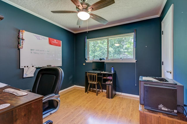 office with light hardwood / wood-style floors, crown molding, a textured ceiling, and ceiling fan