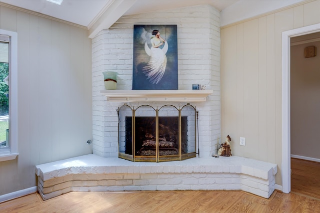 details with hardwood / wood-style floors, a fireplace, and crown molding