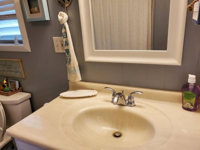 bathroom with vanity and toilet