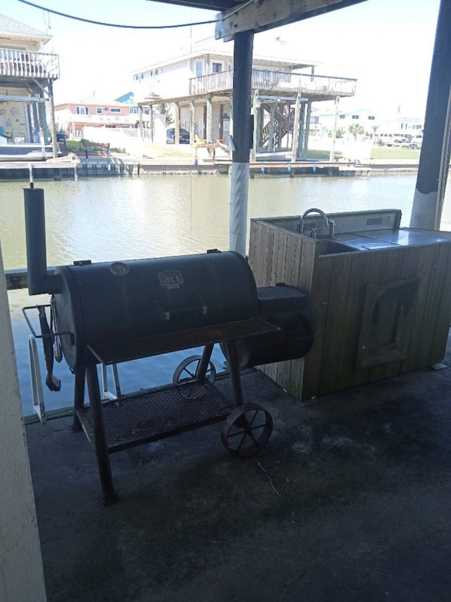 dock area featuring a water view