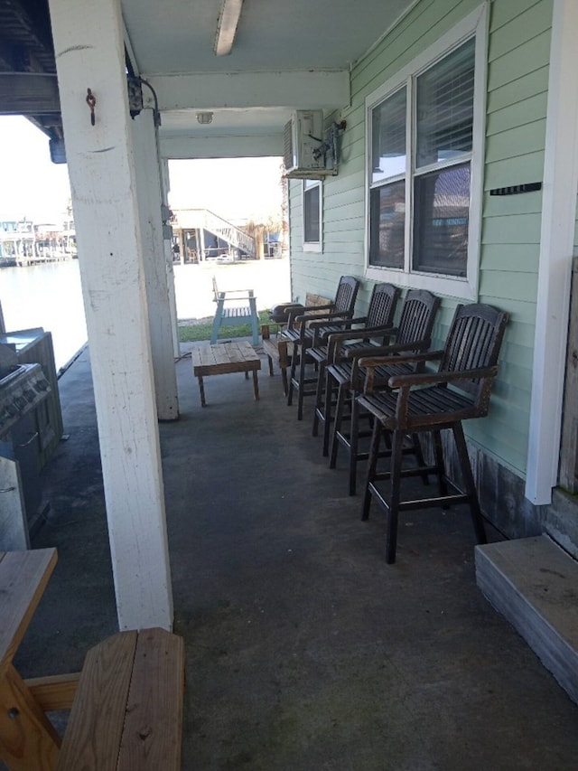 view of patio with a water view