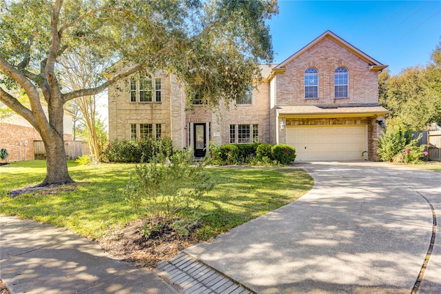 front facade featuring a front yard and a garage