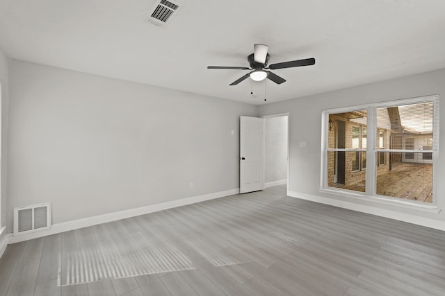 unfurnished room featuring ceiling fan and light hardwood / wood-style flooring