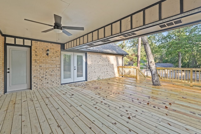 deck with french doors and ceiling fan