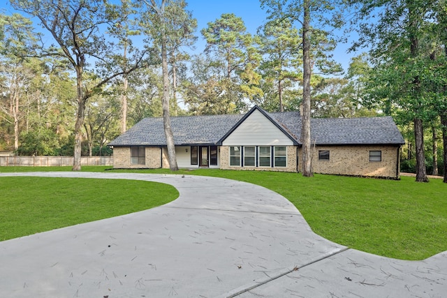 ranch-style house with a front lawn