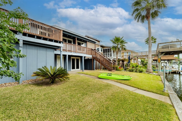 view of yard with a dock and a deck