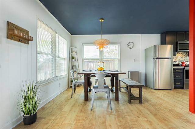 dining space featuring light wood-type flooring