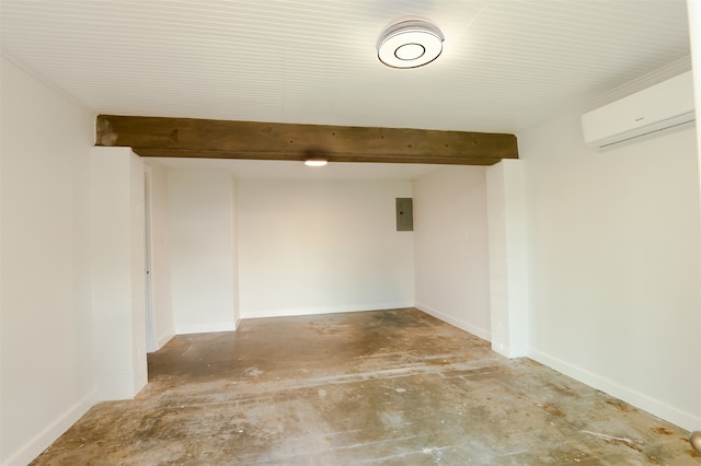 basement featuring electric panel and a wall mounted air conditioner