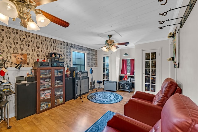 living room with ceiling fan, crown molding, and hardwood / wood-style floors