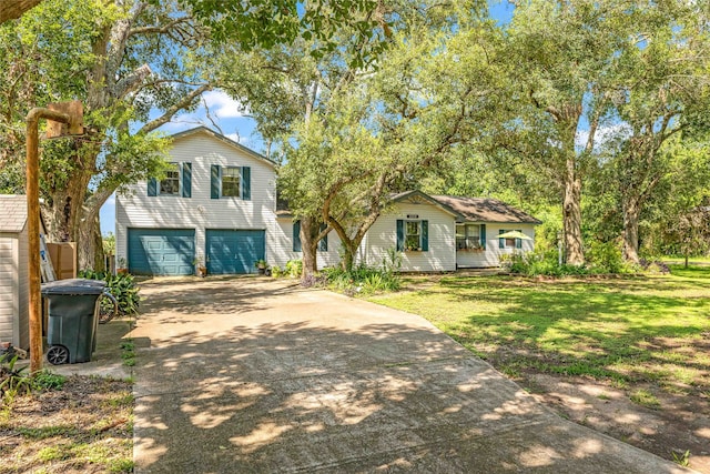 view of front facade featuring a garage and a front lawn