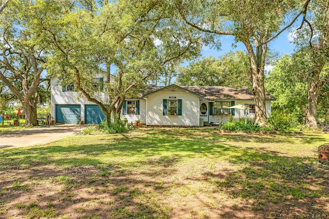 ranch-style house featuring a front lawn and a garage