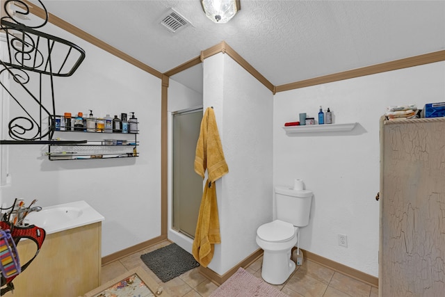 bathroom featuring a shower with door, a textured ceiling, toilet, vanity, and crown molding