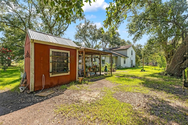 back of house with a yard