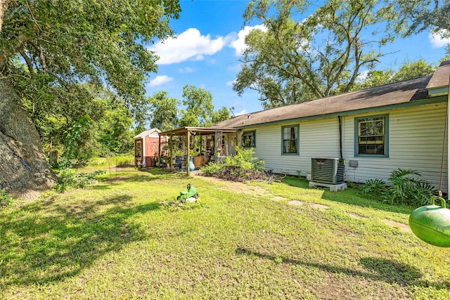 view of yard with central AC