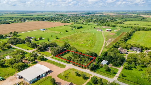 birds eye view of property featuring a rural view