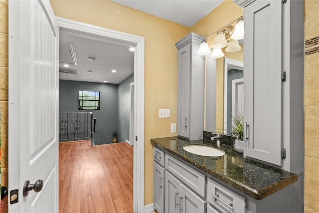 bathroom featuring vanity and hardwood / wood-style flooring