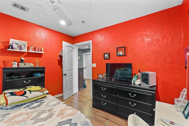 bedroom featuring ceiling fan and hardwood / wood-style floors