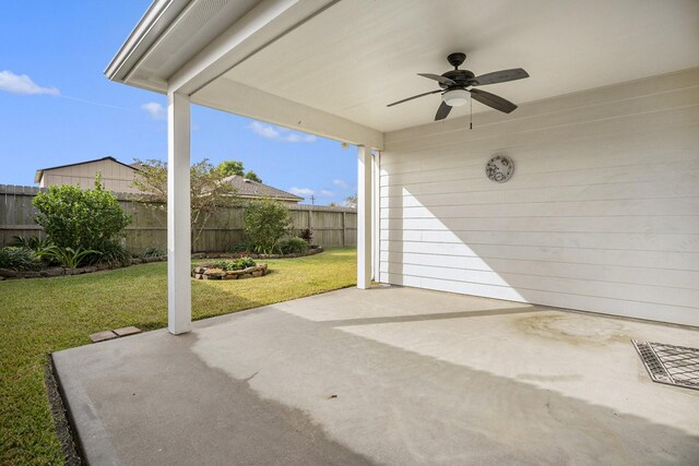 view of patio featuring fence and ceiling fan