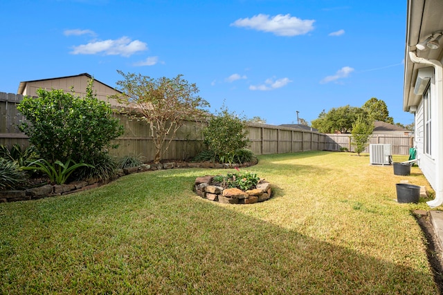 view of yard with cooling unit and a fenced backyard