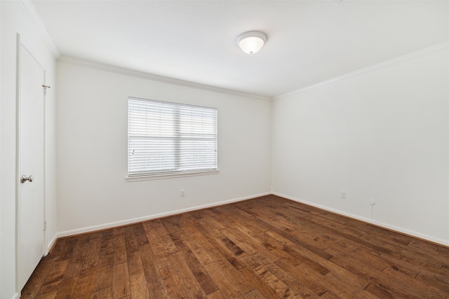 spare room featuring crown molding and dark wood-type flooring